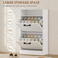 White shoe cabinet with two flip drawers open, showing multiple shoe pairs