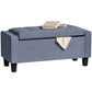 Dark blue-gray upholstered storage ottoman bench with padded armrests and hinged lid