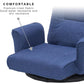 Blue padded seat and tall backrest on a swivel floor chair with armrests.