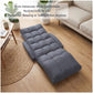 Grey cushioned floor recliner chair lying flat with thick quilted padding