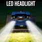Blue remote-controlled crawler lawn mower with LED headlight glow and cutting deck