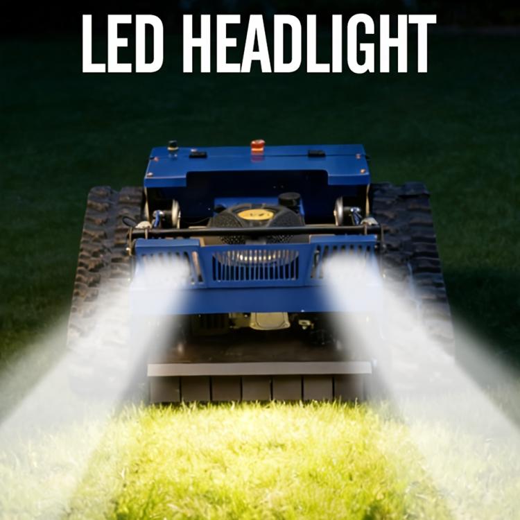 Blue remote-controlled crawler lawn mower with LED headlight glow and cutting deck