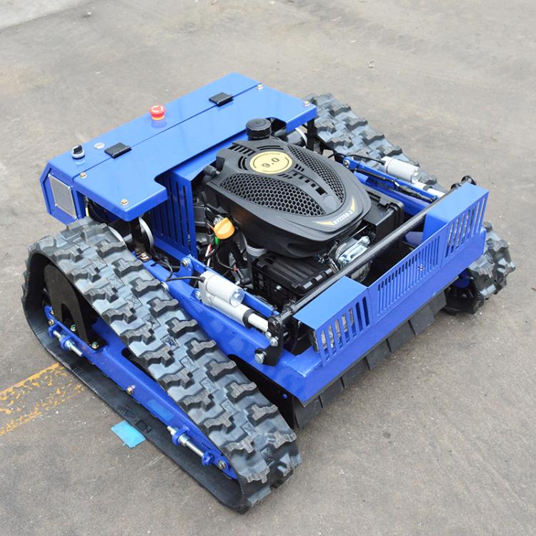Blue remote-controlled crawler lawn mower with exposed engine and heavy-duty tracks