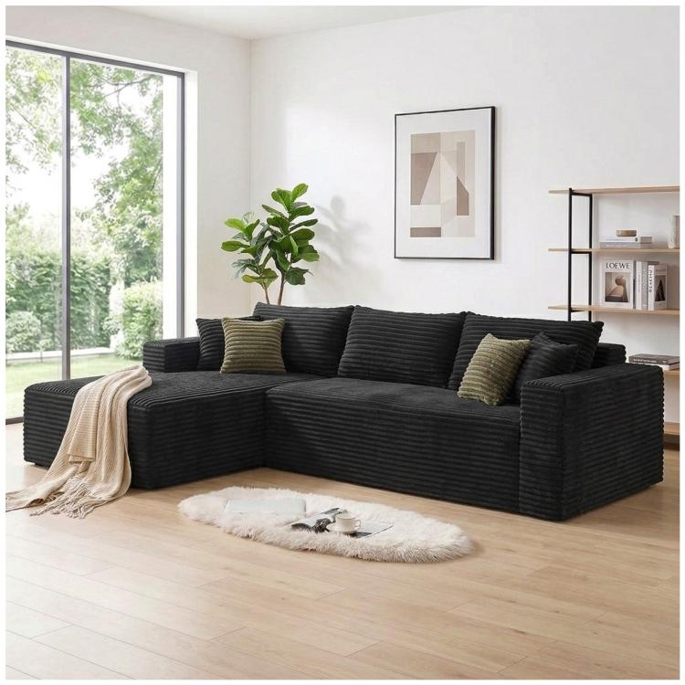 Black corduroy L-shaped sectional sofa with oversized chaise and deep seat cushions