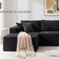 Black corduroy sectional sofa with modular design and stacked seat cushions