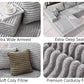 Gray corduroy sectional sofa with wide armrests and deep seat cushions