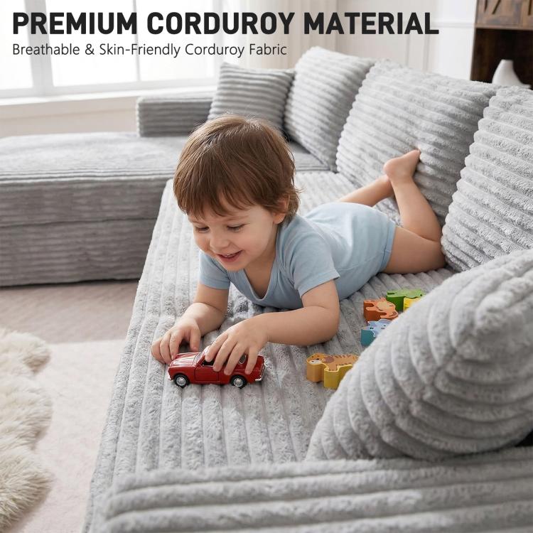 Grey corduroy sectional sofa with plush cushions and deep seat lounge area