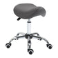 Gray saddle stool with rounded cushioned seat and chrome caster base
