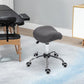 Gray height-adjustable saddle stool on chrome base with swivel casters