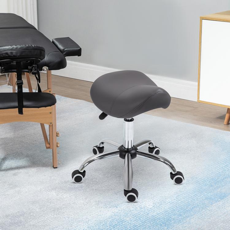Gray height-adjustable saddle stool on chrome base with swivel casters