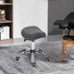 Gray cushioned saddle chair stool with chrome pedestal and rolling casters
