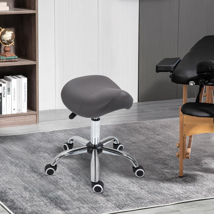 Gray cushioned saddle chair stool with chrome pedestal and rolling casters