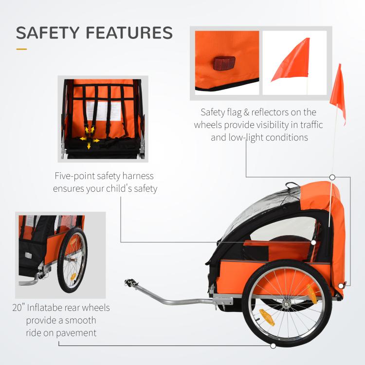 Orange and black child bike trailer with 5-point harness, flag, and inflatable wheels