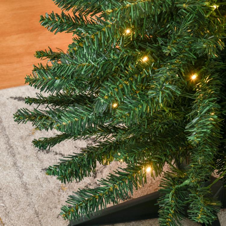 Green artificial pencil Christmas tree branch tips with warm white LED lights
