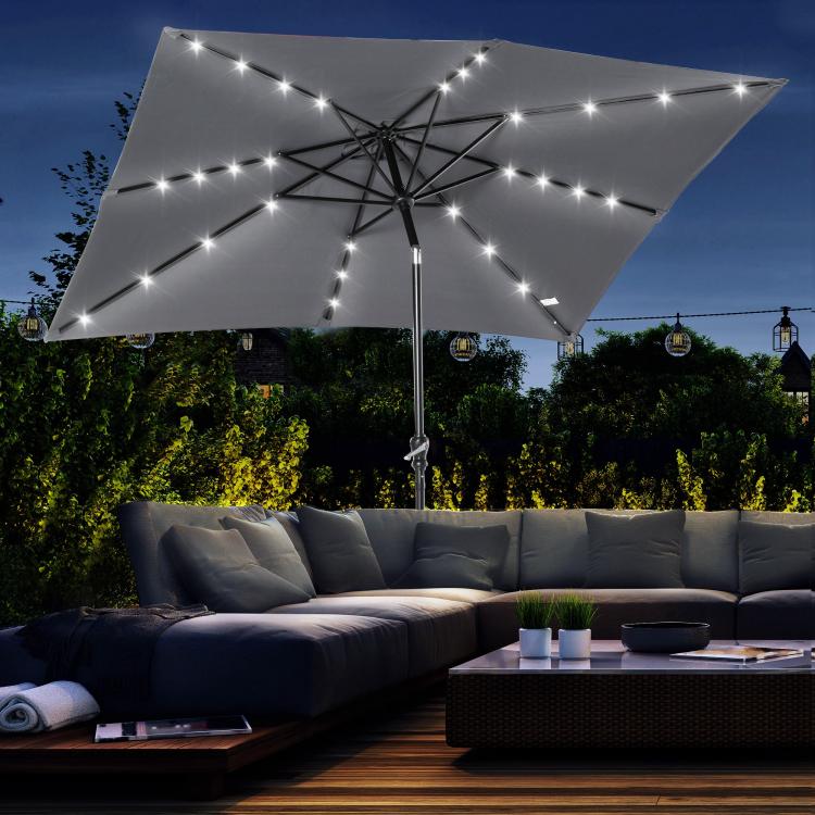 Gray solar LED patio umbrella with fabric canopy and starry light string