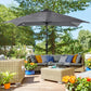 Gray outdoor patio umbrella with solar LED lights over lounge seating