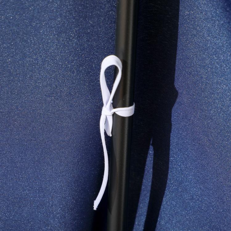 Dark blue fabric canopy corner with white tie strap and grommet on metal support