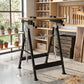 Adjustable work bench stand with black steel legs, wooden top, four clamp heads