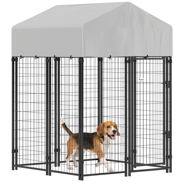 Outdoor dog kennel with black welded wire panels and white roof, with escape-proof door