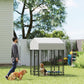 Outdoor dog kennel with white roof and black welded wire enclosure in backyard setting