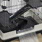 Close-up of black wire ramp and perforated tray area with clear slide-out bottom tray