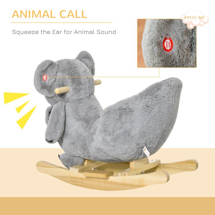 Gray plush koala rocking horse showing ear call button and seated doll front