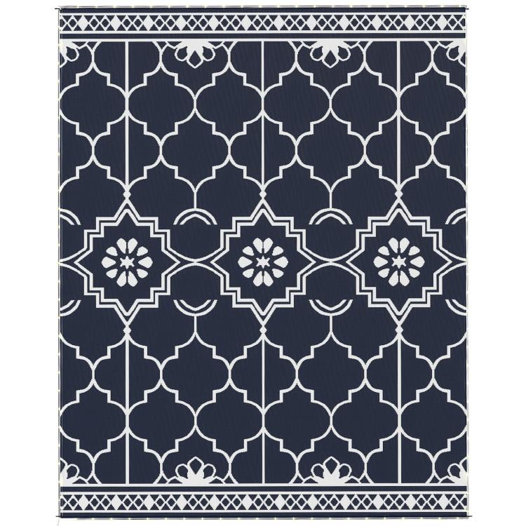 Reversible outdoor rug with navy and white lattice, diamond medallion pattern