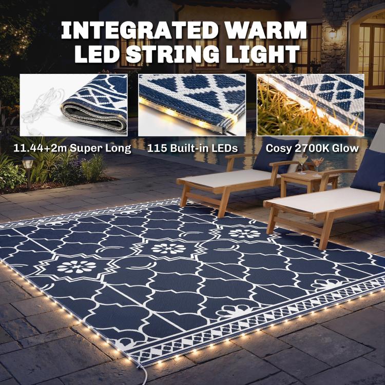 Patio set with outdoor rug featuring integrated warm LED border and white geometric pattern