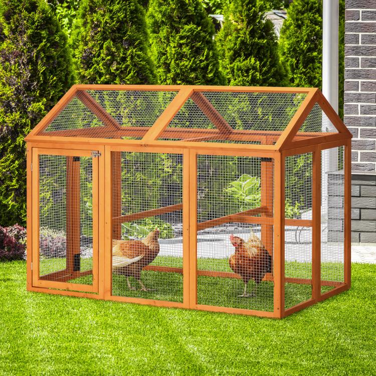 Orange wooden chicken run with wire mesh walls and interior perches for outdoor use