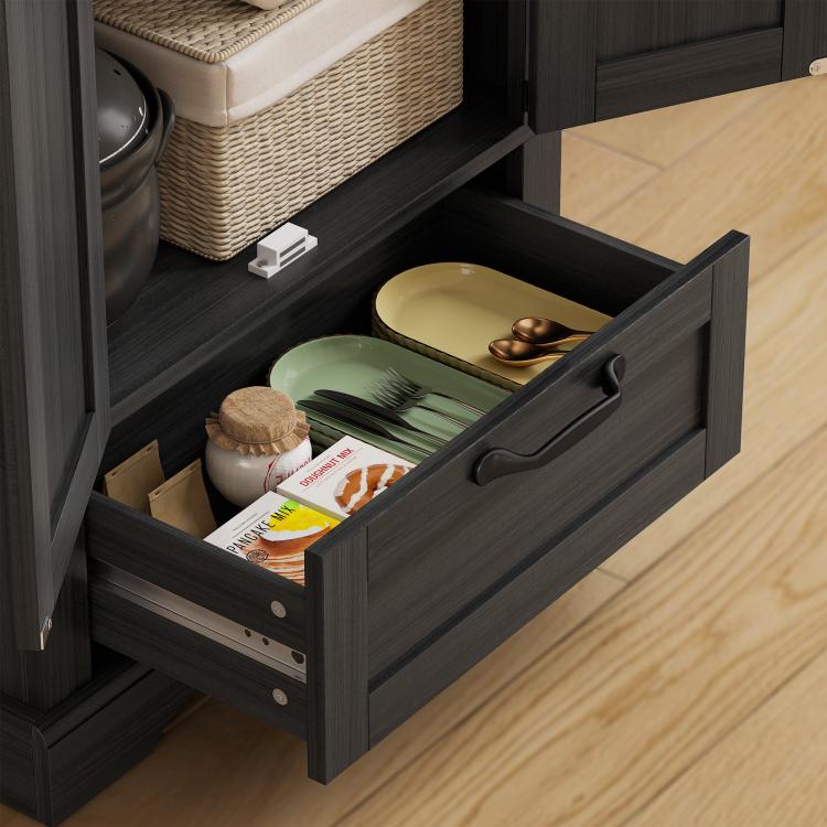 Kitchen pantry cabinet in dark finish with pull-out drawer and open lower shelves