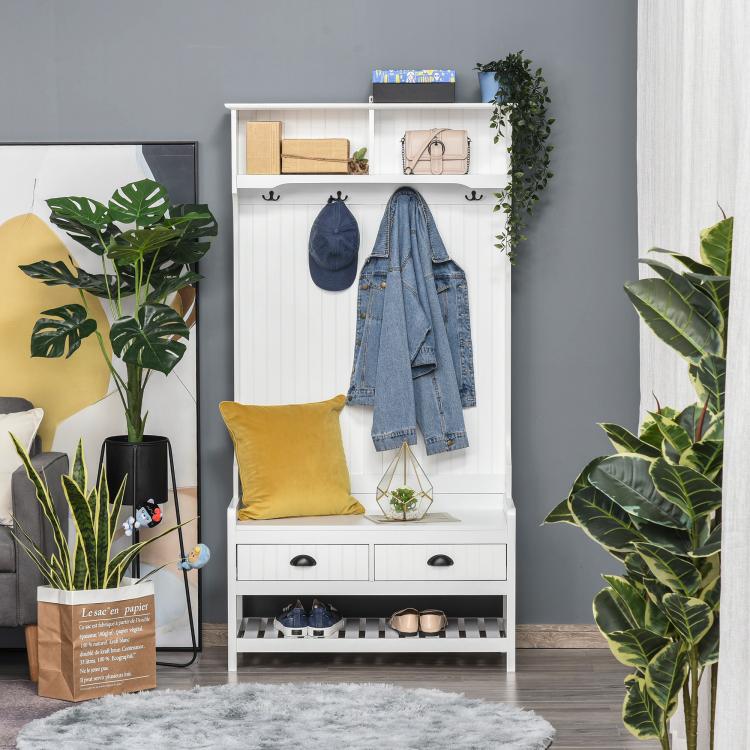 White hall tree with coat hooks, padded seat, two drawers, and lower shoe shelf