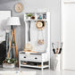 White entryway hall tree with padded bench seat, hanging hooks, two drawers, shoe rack