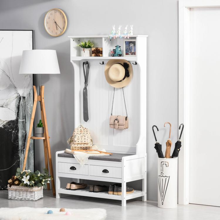 White entryway hall tree with padded bench seat, hanging hooks, two drawers, shoe rack