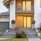 Artificial topiary balls in gray planters beside front steps and entry door