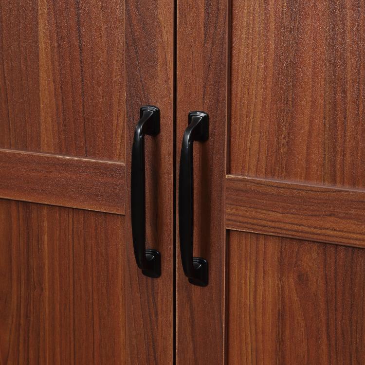 Brown freestanding kitchen pantry cabinet with black recessed door handles