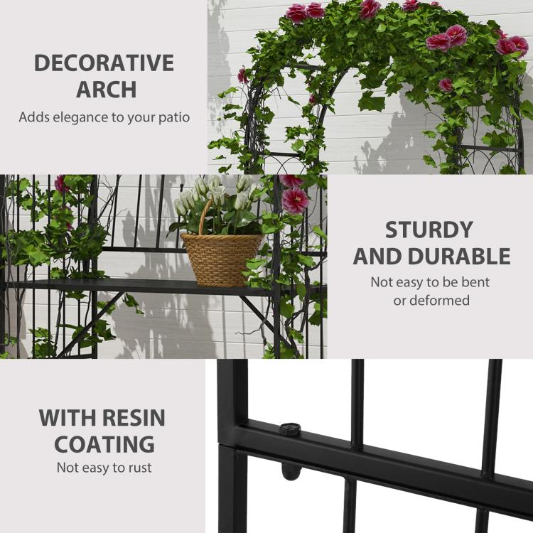 Black metal arbor bench with trellis top, leafy vines and hanging flower baskets