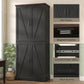 Black pantry cabinet with barn doors, metal handles, and black accent base