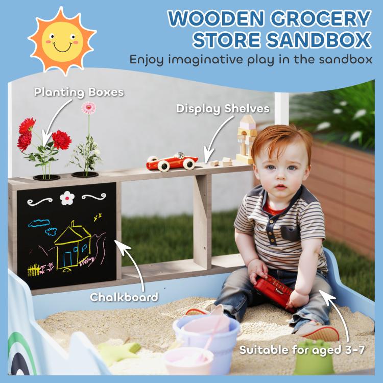 Blue wooden sandbox play area with chalkboard panel, canopy, and bench seating
