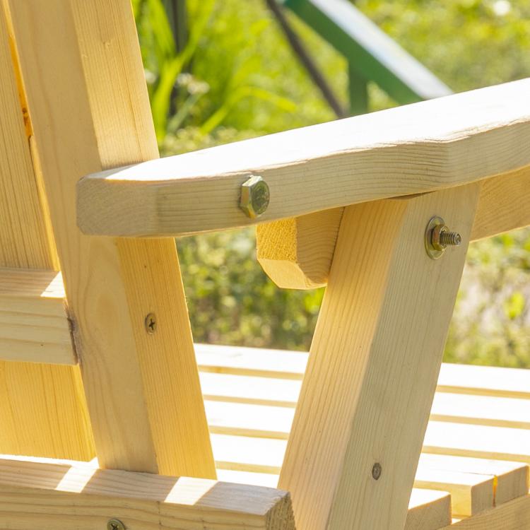 Natural wood patio bench with middle table and umbrella hole, close-up corner