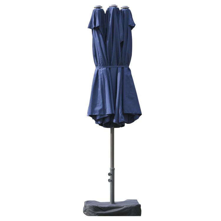 Dark blue patio umbrella with closed canopy fabric bundle on a tall pole