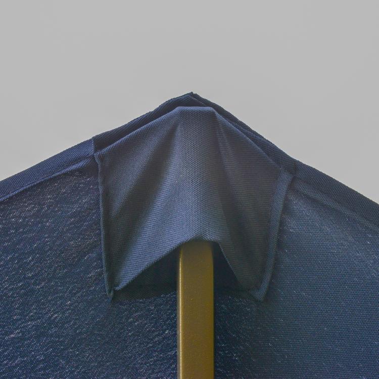 Dark blue rectangular patio umbrella canopy close-up with central pole