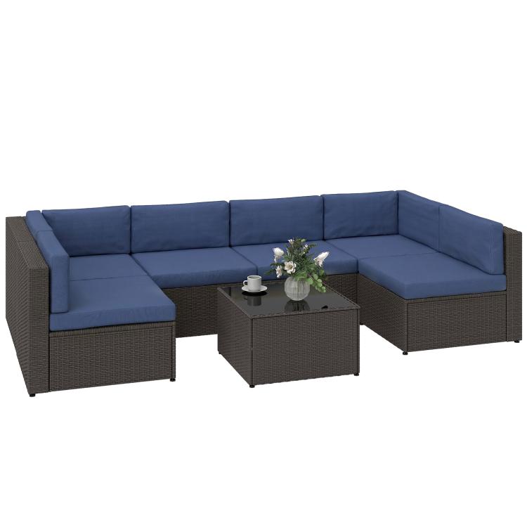 Outdoor rattan-style sectional sofa set with navy cushions and dark wicker coffee table