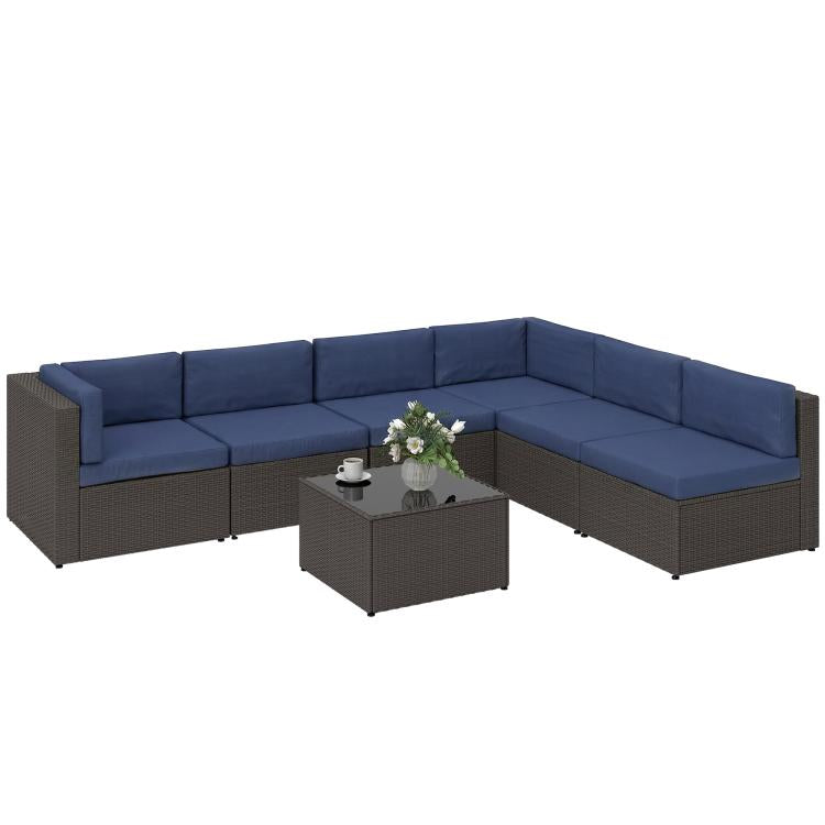 L-shaped outdoor sofa sectional with navy cushions and dark wicker coffee table