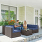 Corner outdoor sofa sectional with dark wicker arms and blue seat cushions
