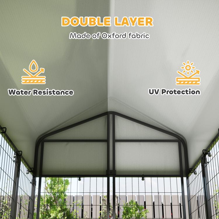 Outdoor dog kennel roof with white fabric cover over black welded wire walls, open front.