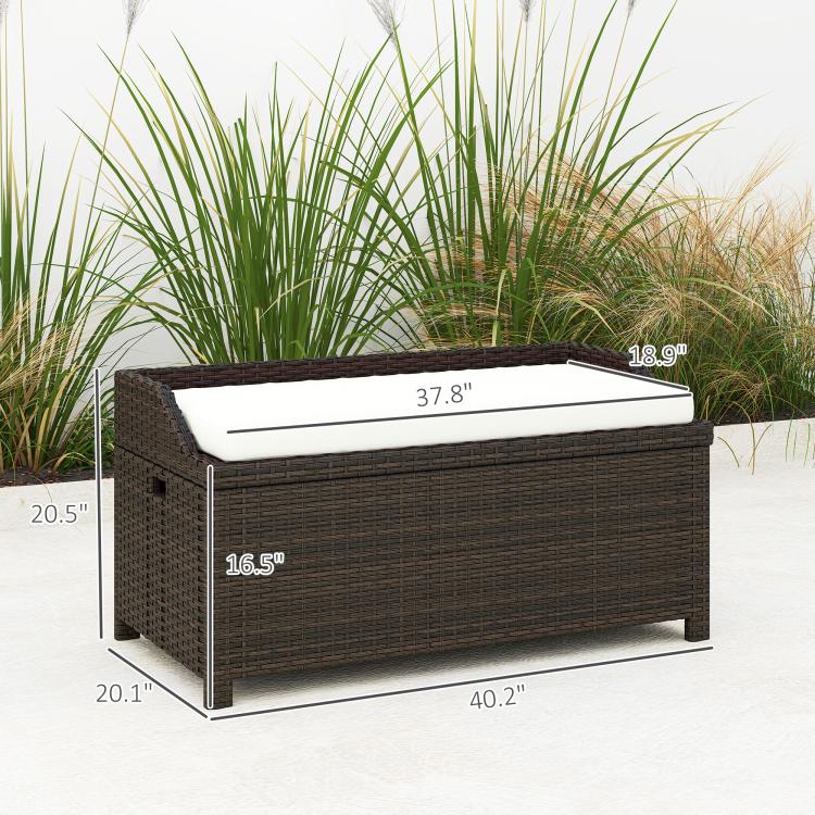 Outdoor wicker storage bench, dark brown woven frame with light cream cushion on top