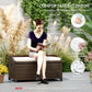 Outdoor wicker storage bench with cream cushion, dark brown woven sides, person seated
