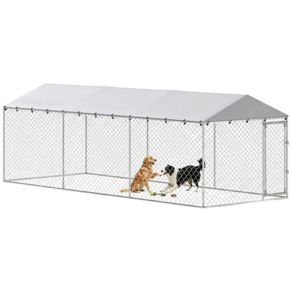 Outdoor dog kennel with silver chain-link panels and sloped waterproof roof, front entry with dogs