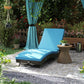 Outdoor chaise lounge chair with sky blue cushion, adjustable headrest, and dark wicker base