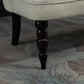 Cream armless loveseat with dark turned wood legs
